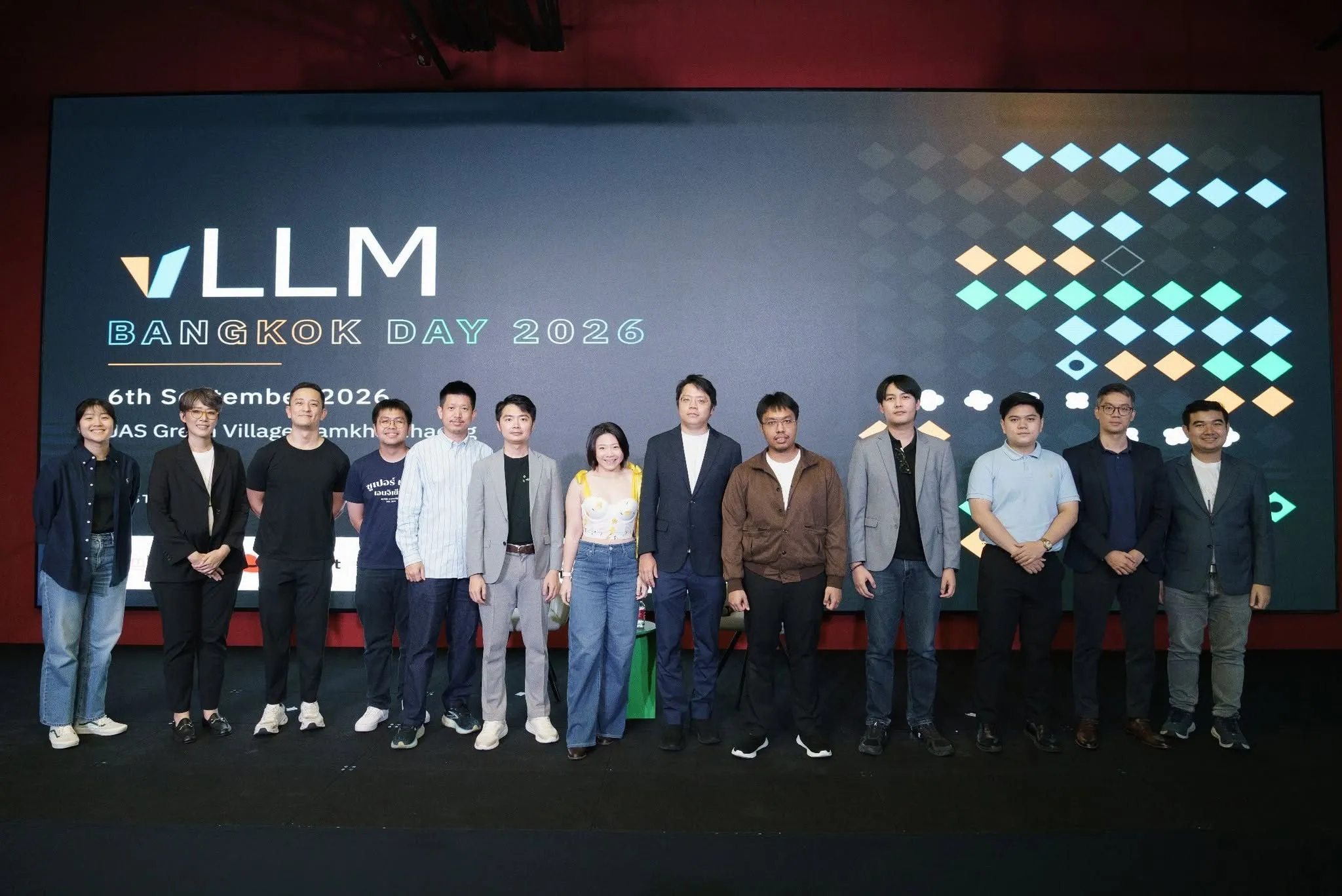 Speakers and organisers together on stage under the vLLM Bangkok Day 2026 LED wall