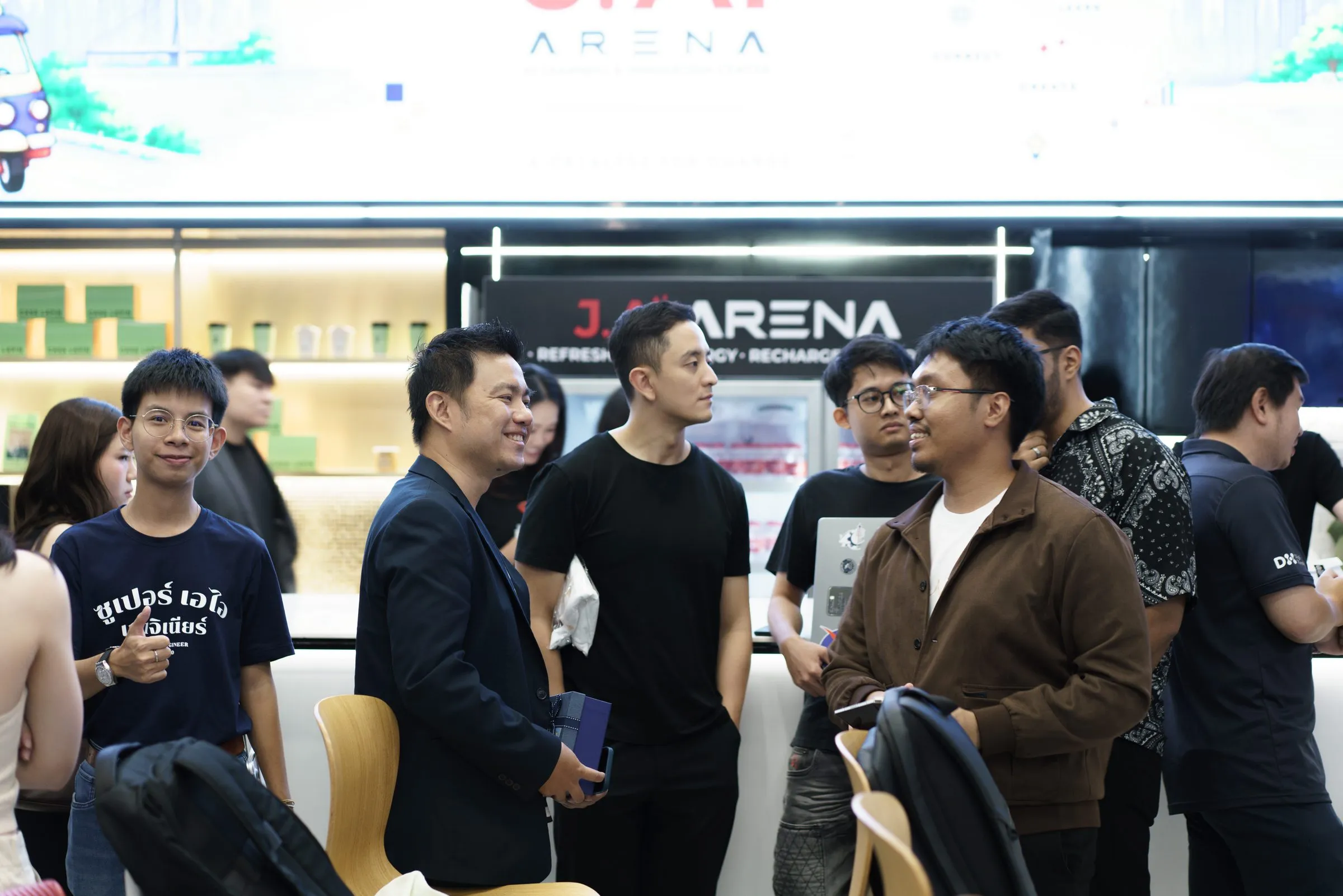 Speakers and attendees mingling at the break